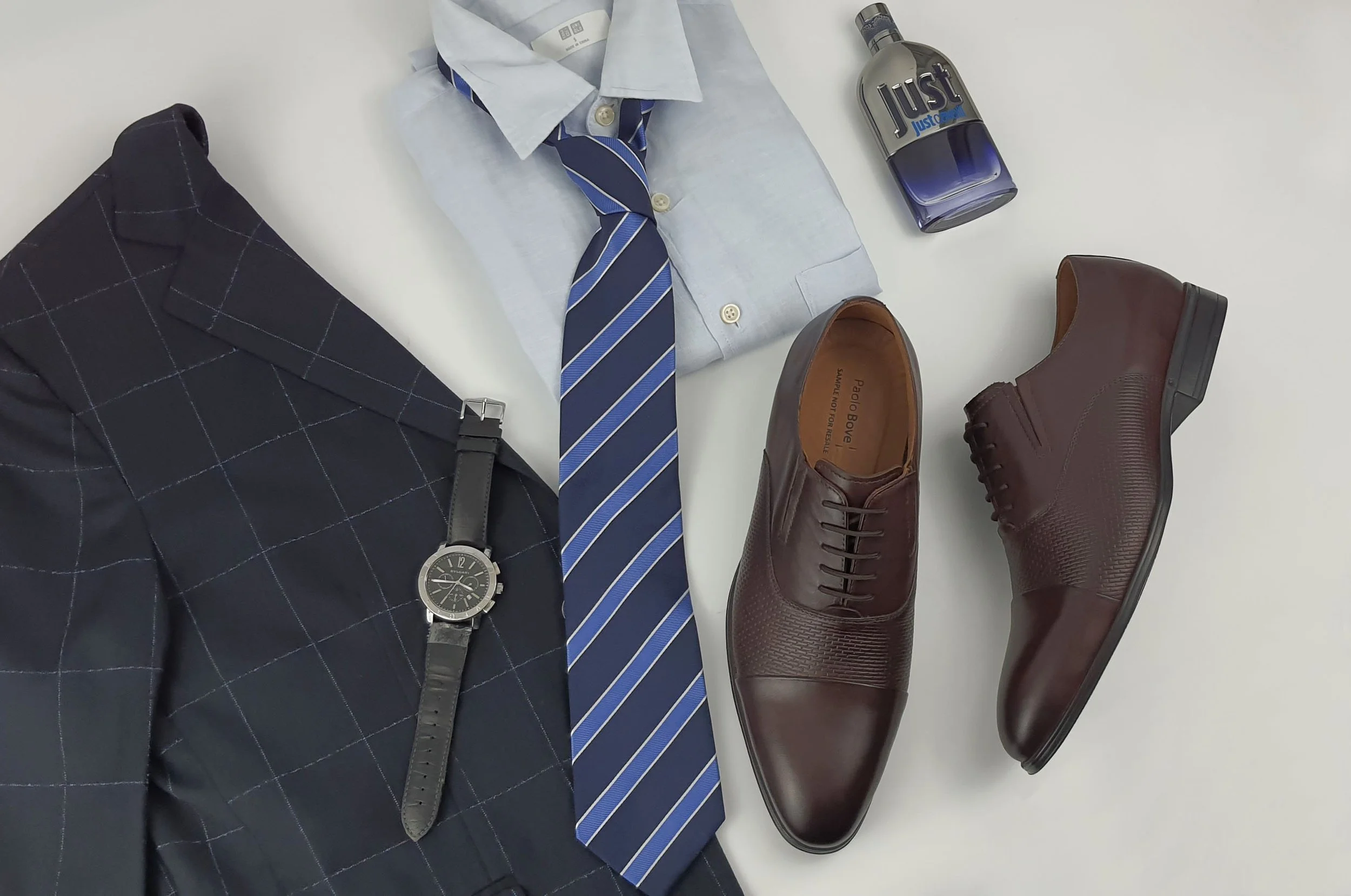 Brown leather derby shoes styled with a suit, shirt and tie